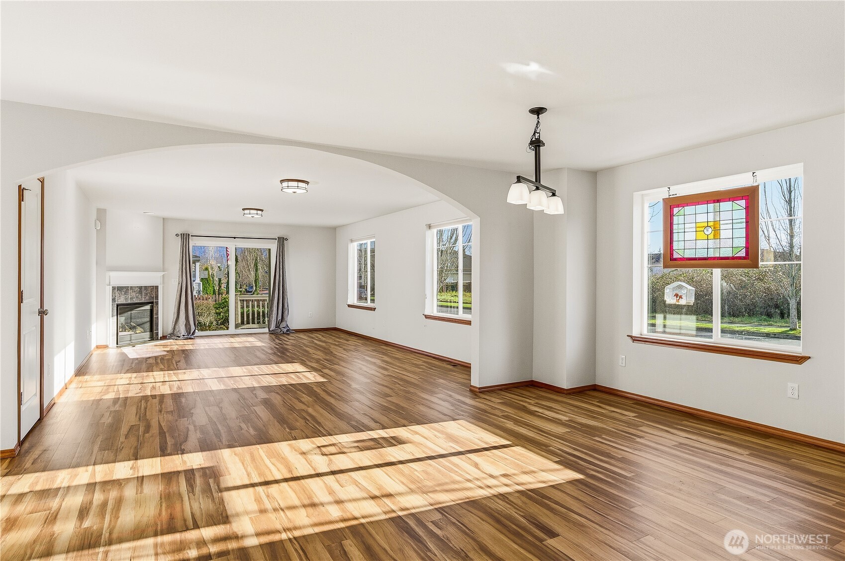3043 Scotland Alley Mount Vernon, WA 98273 - Photo 11 of 32 a view of an empty room with wooden floor and a window