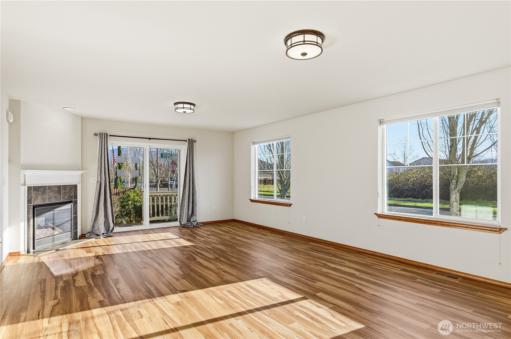 3043 Scotland Alley Mount Vernon, WA 98273 - Photo 13 of 32 a view of an empty room with wooden floor and a window