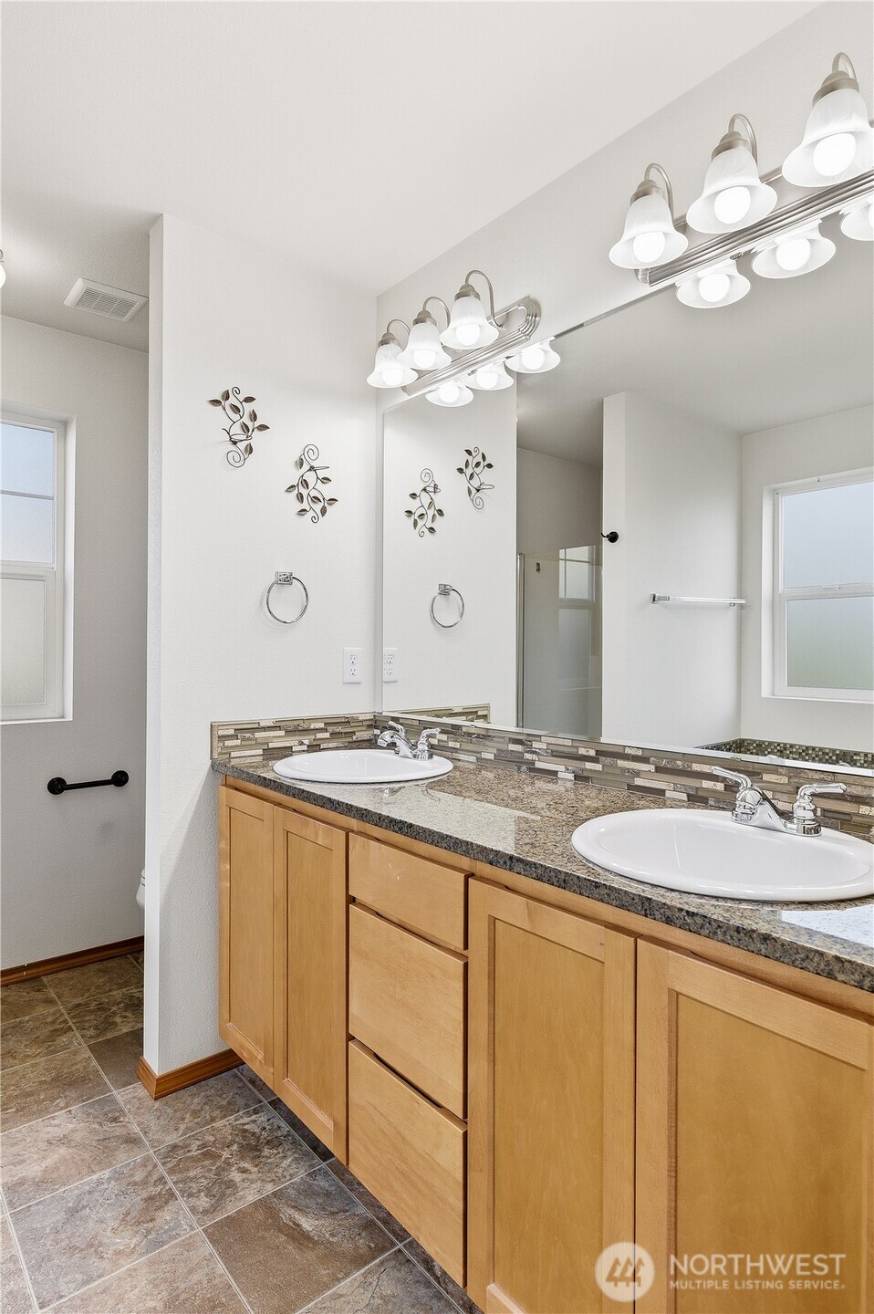 3043 Scotland Alley Mount Vernon, WA 98273 - Photo 18 of 32 a bathroom with a granite countertop sink and a mirror