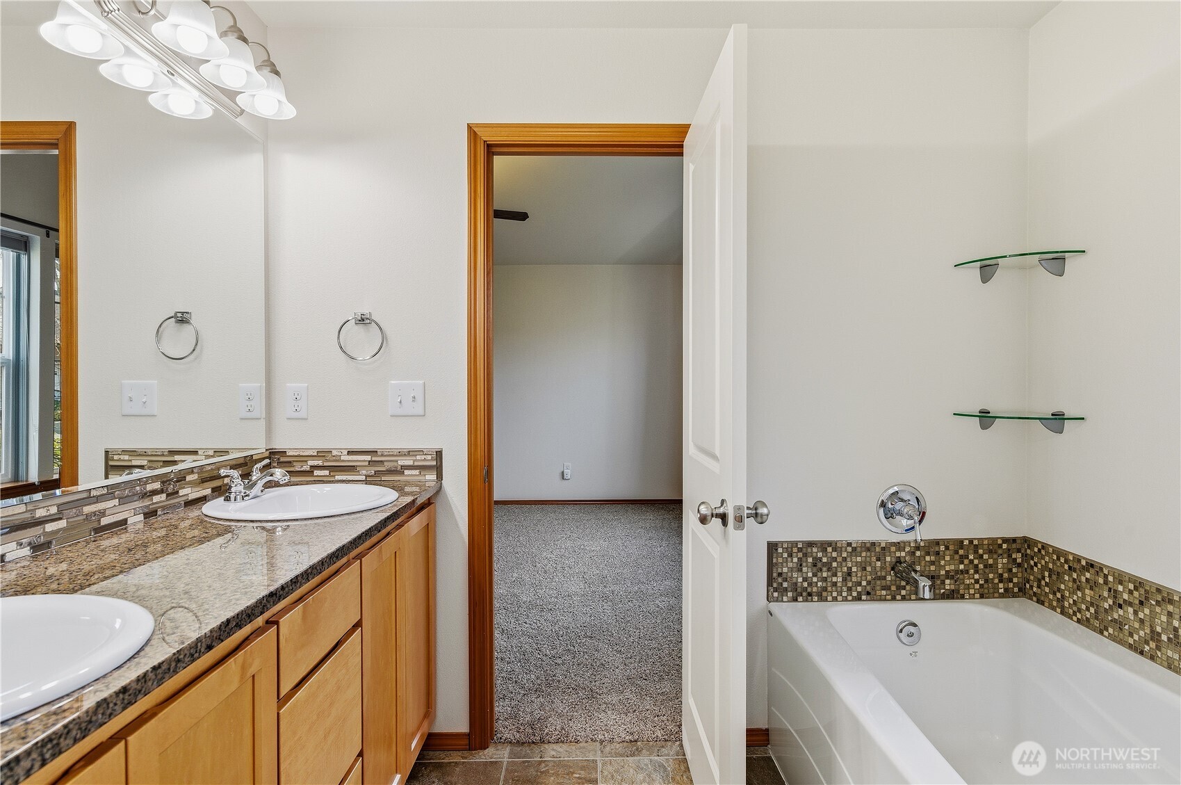 3043 Scotland Alley Mount Vernon, WA 98273 - Photo 19 of 32 a bathroom with a tub sink and mirror