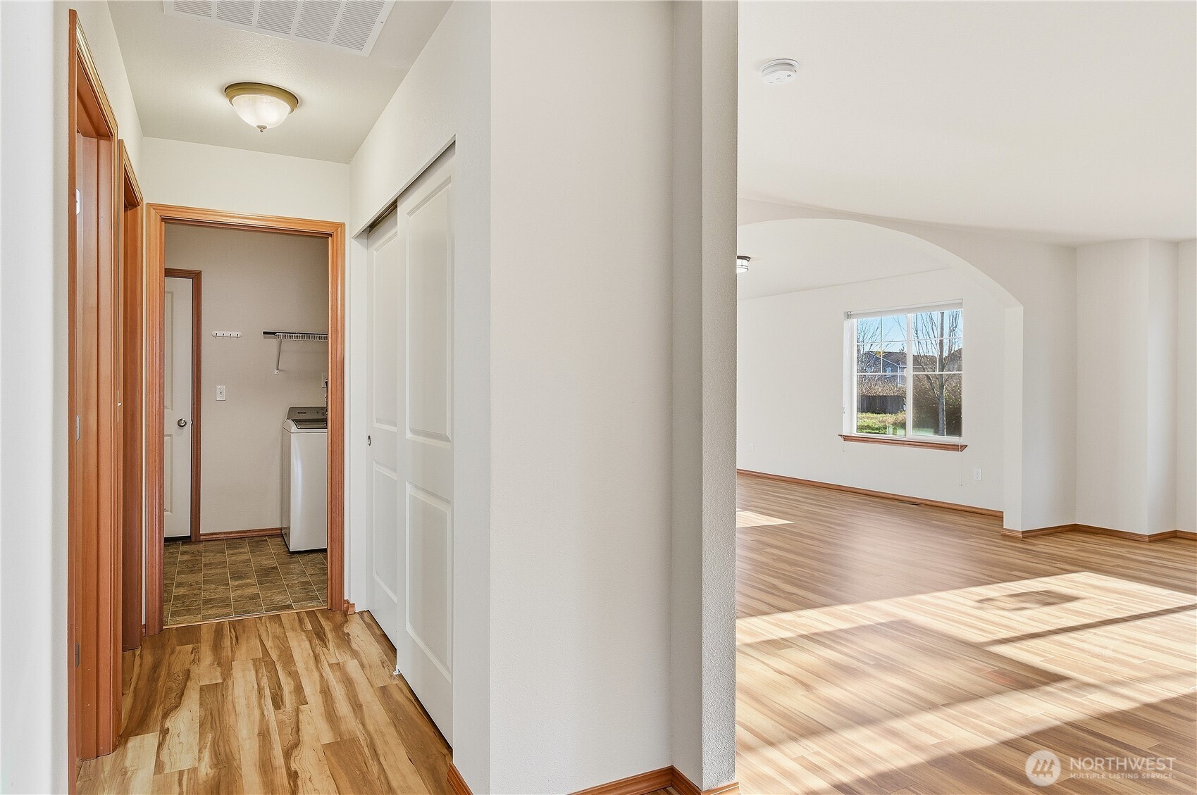 3043 Scotland Alley Mount Vernon, WA 98273 - Photo 27 of 32 a view of a hallway with wooden floor and a living room