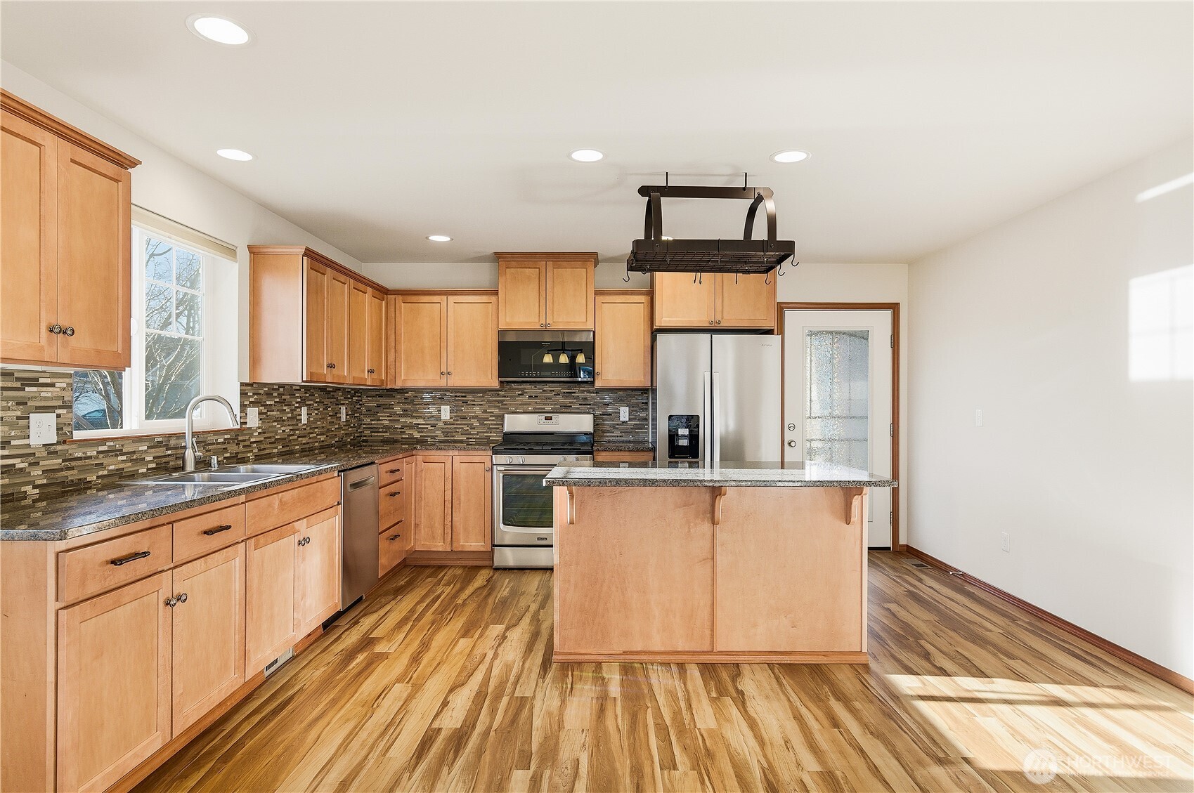 3043 Scotland Alley Mount Vernon, WA 98273 - Photo 7 of 32 a kitchen with stainless steel appliances granite countertop a stove a sink and a refrigerator