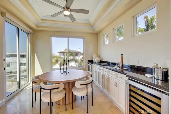 a kitchen with a table chairs stove and cabinets