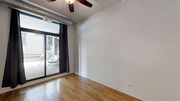 a view of an entryway with wooden floor