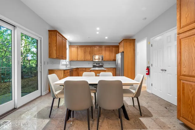 a view of a dining room with furniture window and outside view