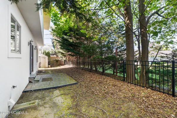 a view of backyard with green space