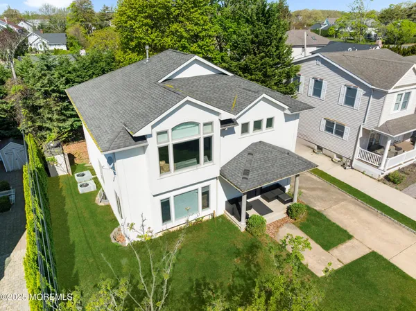 a aerial view of a house with a yard