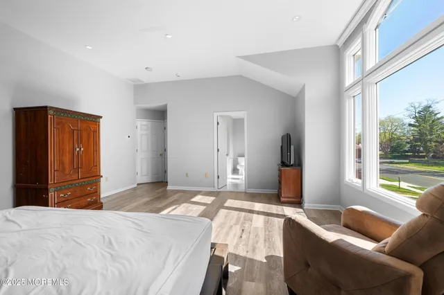 a bedroom with a bed and a couch