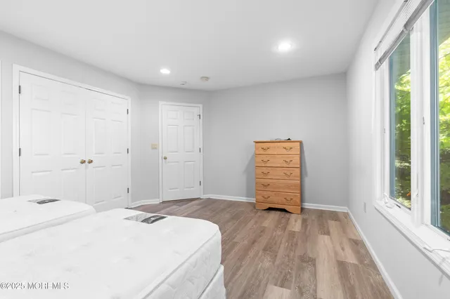 a room with a bed and a window