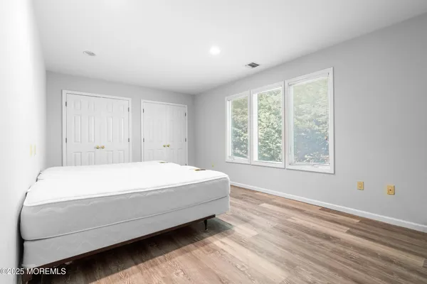 a room with a bed and a window