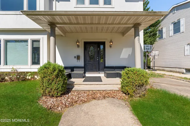 a front view of a house with garden