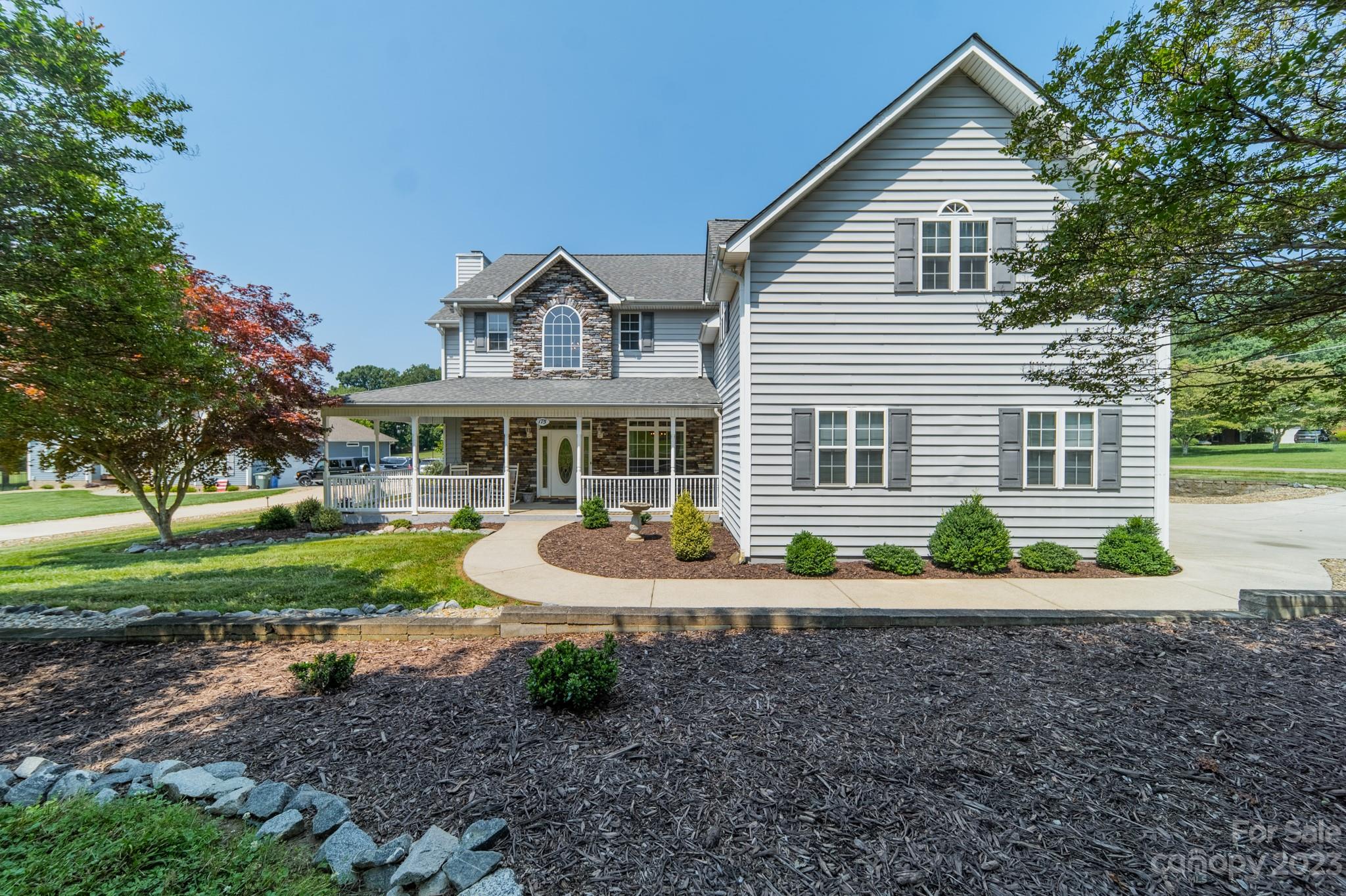 175 Perrin Road Mooresville, NC 28117 - Photo 1 of 45 a front view of a house with a yard and porch