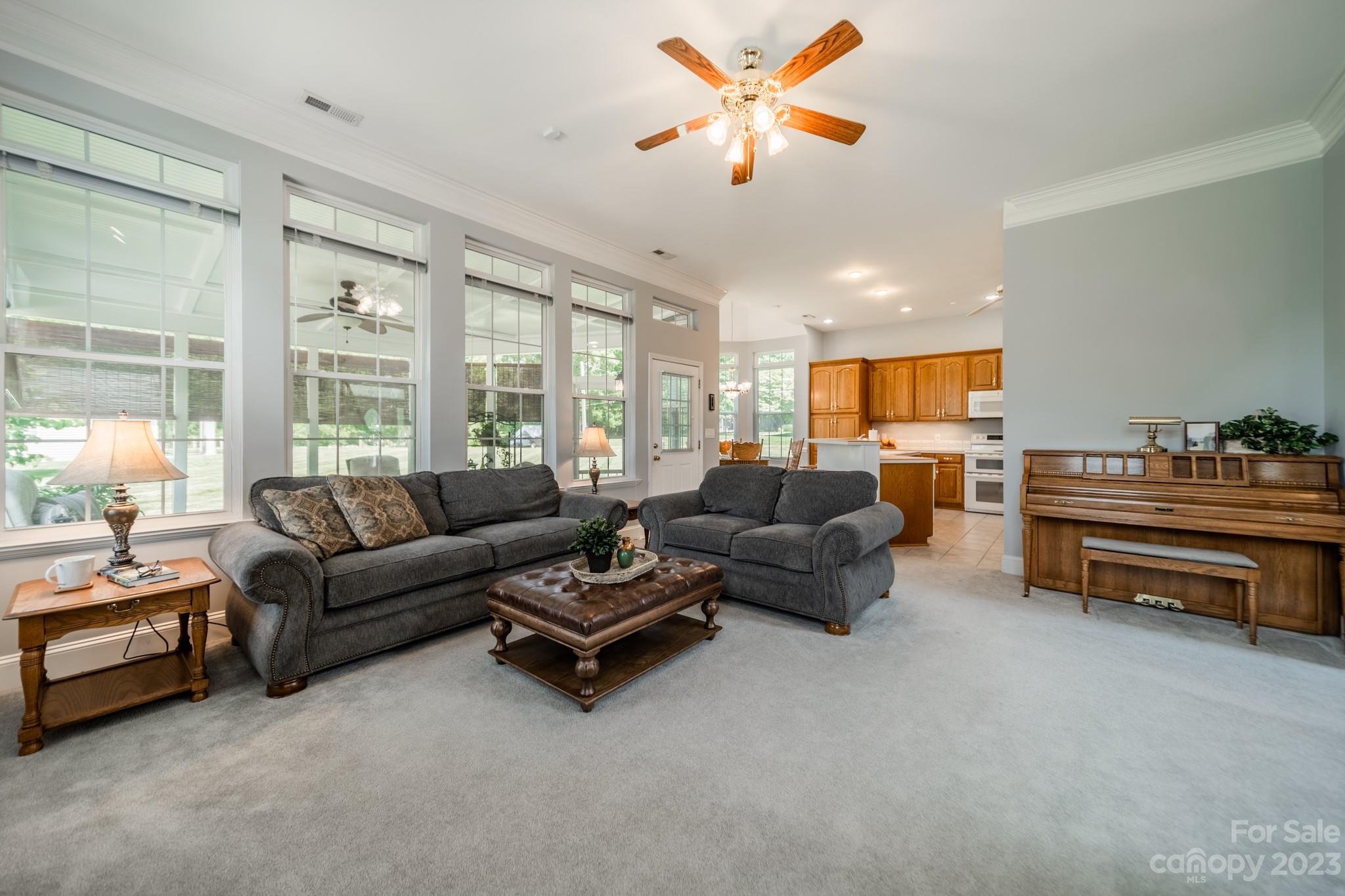175 Perrin Road Mooresville, NC 28117 - Photo 12 of 45 a living room with furniture and a large window