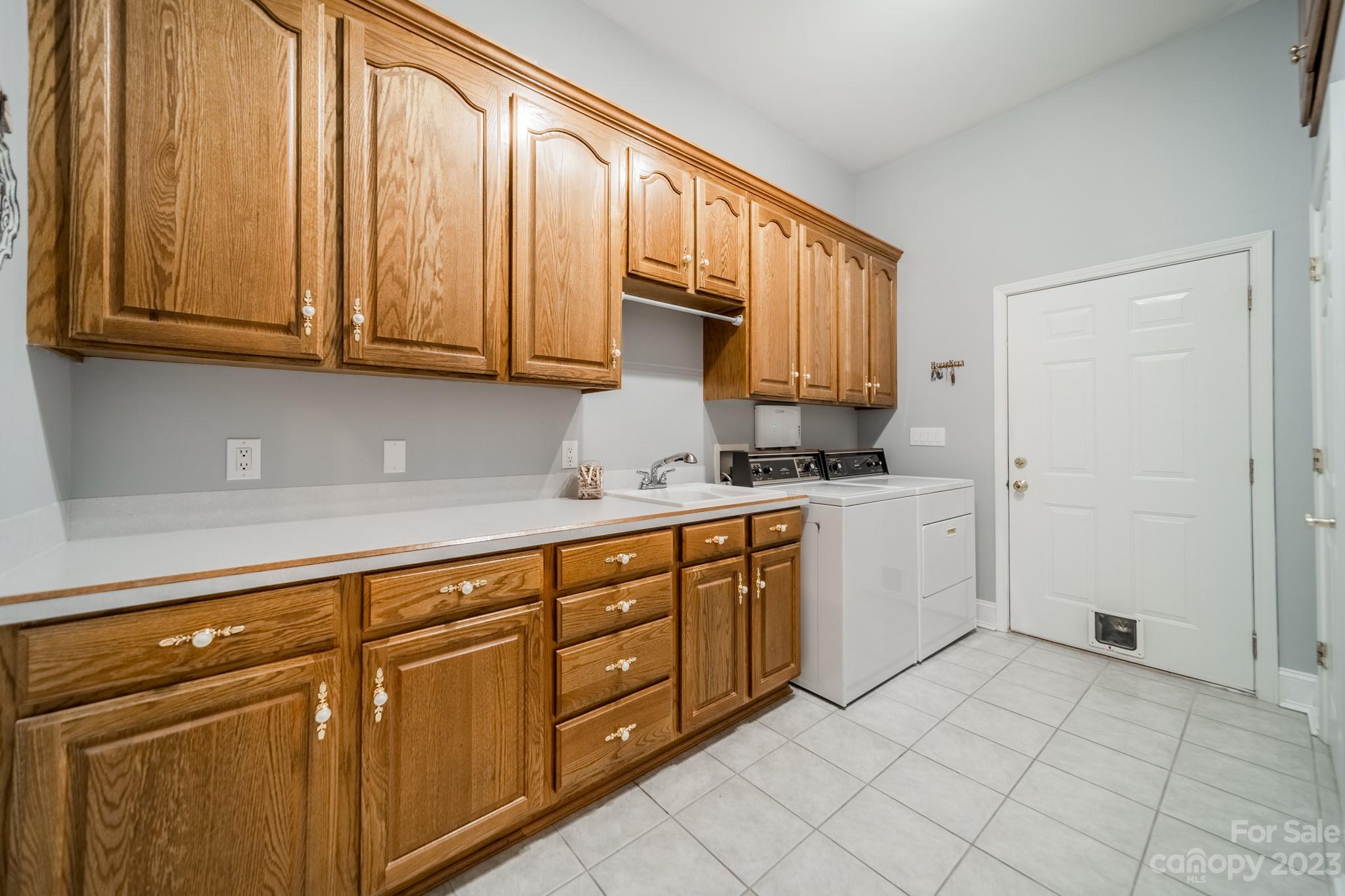 175 Perrin Road Mooresville, NC 28117 - Photo 15 of 45 a kitchen with stainless steel appliances granite countertop a sink and cabinets