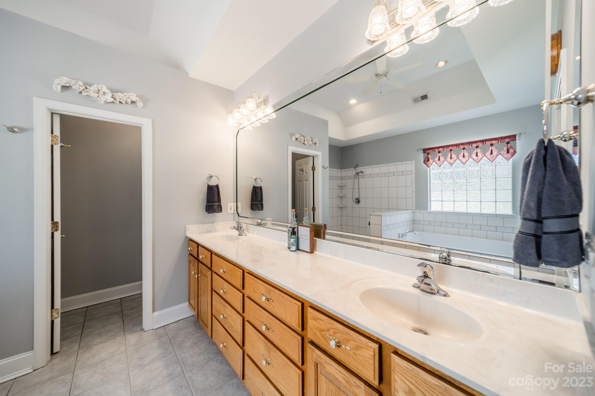 175 Perrin Road Mooresville, NC 28117 - Photo 19 of 45 a bathroom with double vanity and a mirror