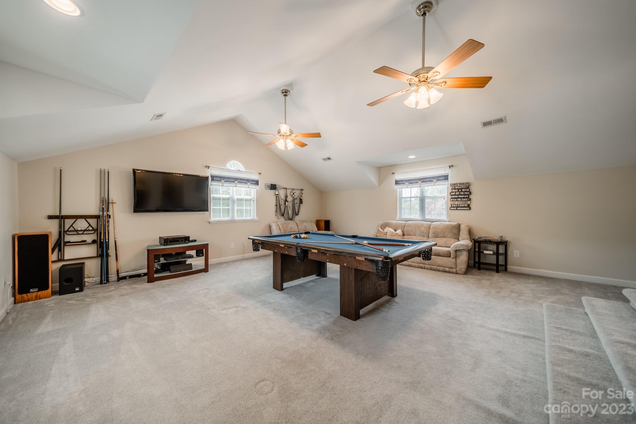 175 Perrin Road Mooresville, NC 28117 - Photo 28 of 45 a living room with furniture and a flat screen tv