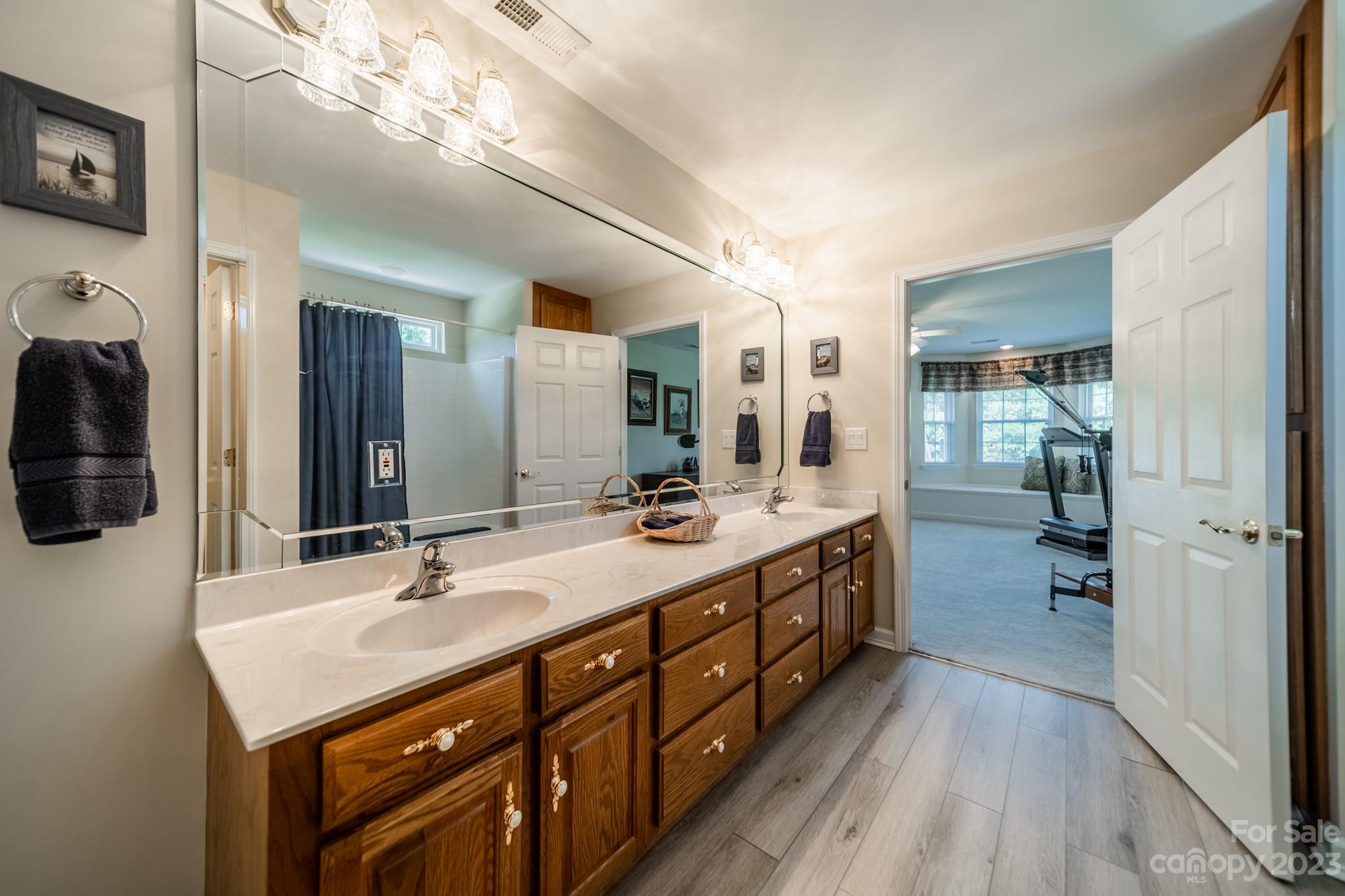 175 Perrin Road Mooresville, NC 28117 - Photo 29 of 45 a bathroom with a double vanity sink and mirror