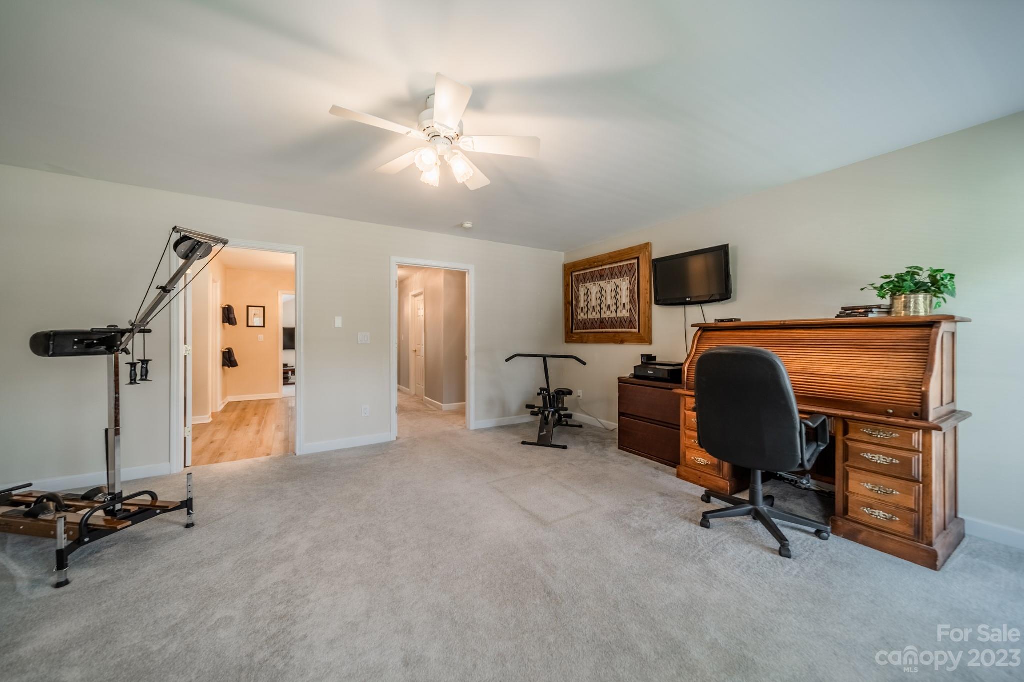 175 Perrin Road Mooresville, NC 28117 - Photo 30 of 45 a view of a workspace with furniture and a livingroom