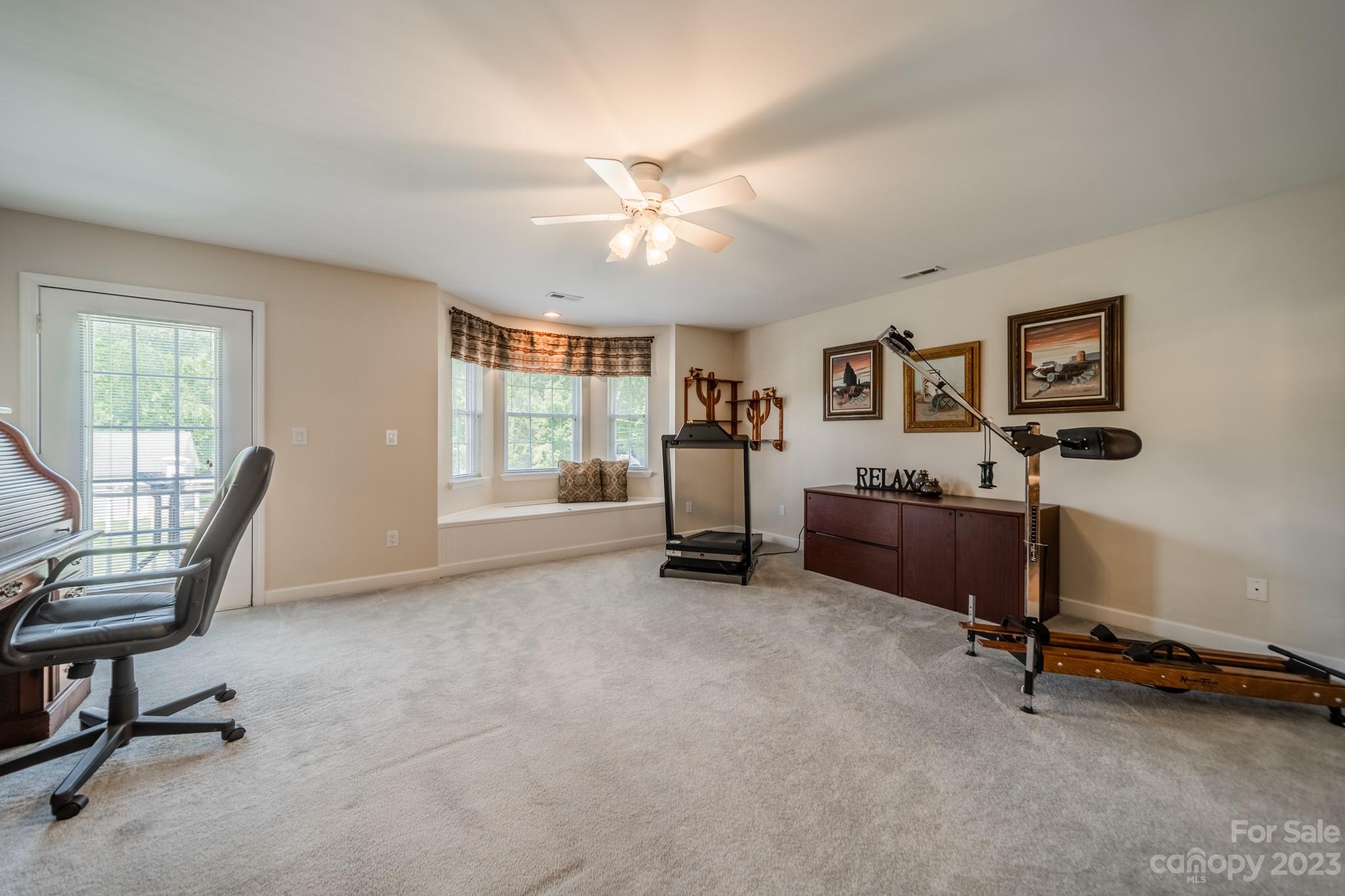 175 Perrin Road Mooresville, NC 28117 - Photo 31 of 45 a view of a livingroom with workspace and a window