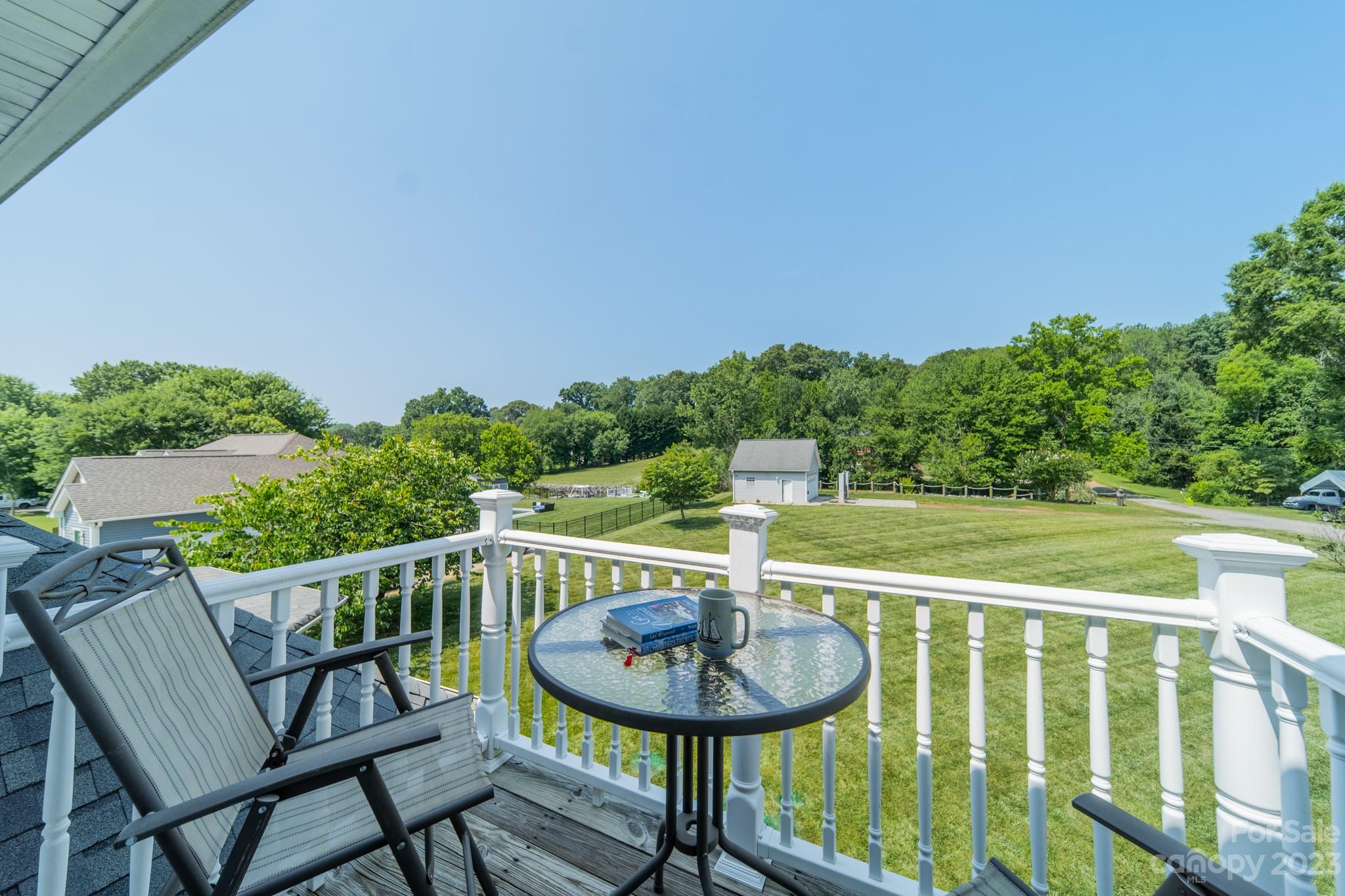 175 Perrin Road Mooresville, NC 28117 - Photo 32 of 45 a view of a chair and table on the deck