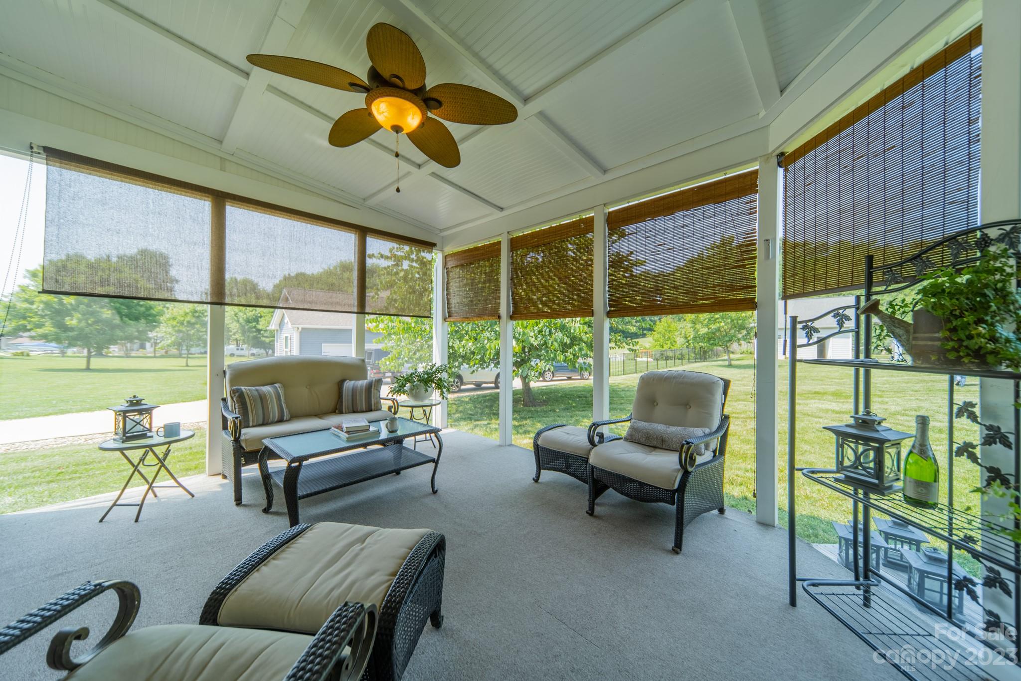 175 Perrin Road Mooresville, NC 28117 - Photo 33 of 45 a living room with furniture and a floor to ceiling window