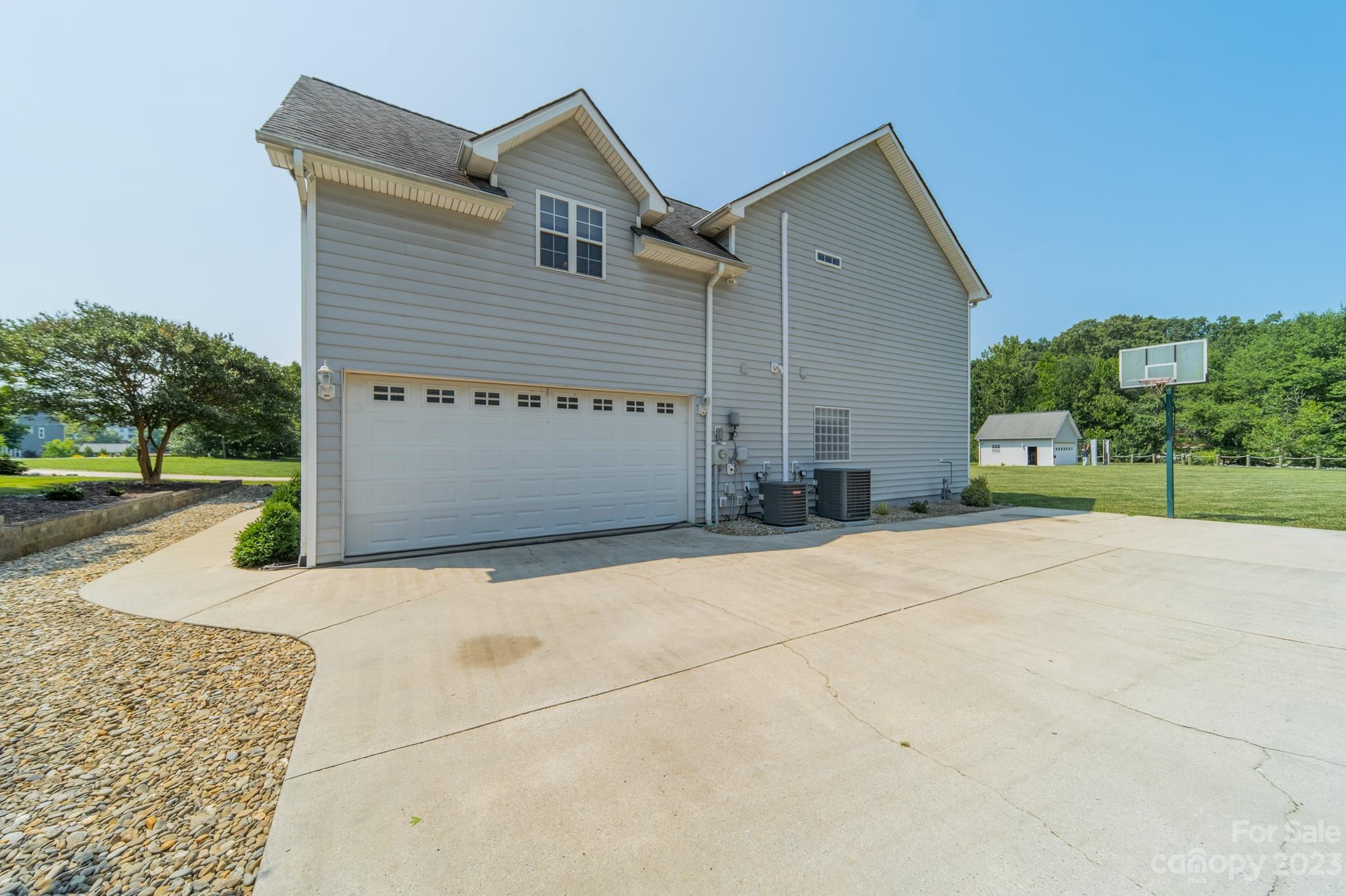 175 Perrin Road Mooresville, NC 28117 - Photo 35 of 45 a front view of a house with a yard and garage