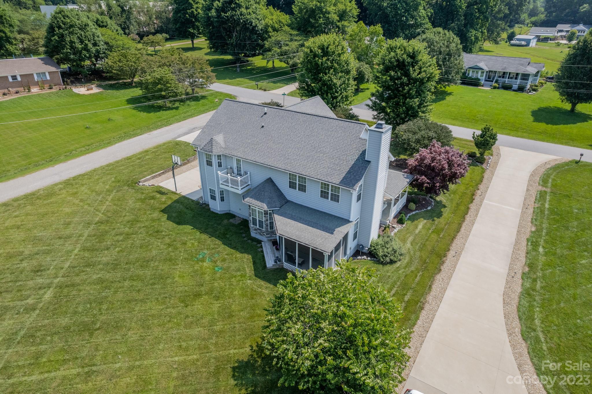 175 Perrin Road Mooresville, NC 28117 - Photo 37 of 45 a aerial view of a house with a big yard and large trees