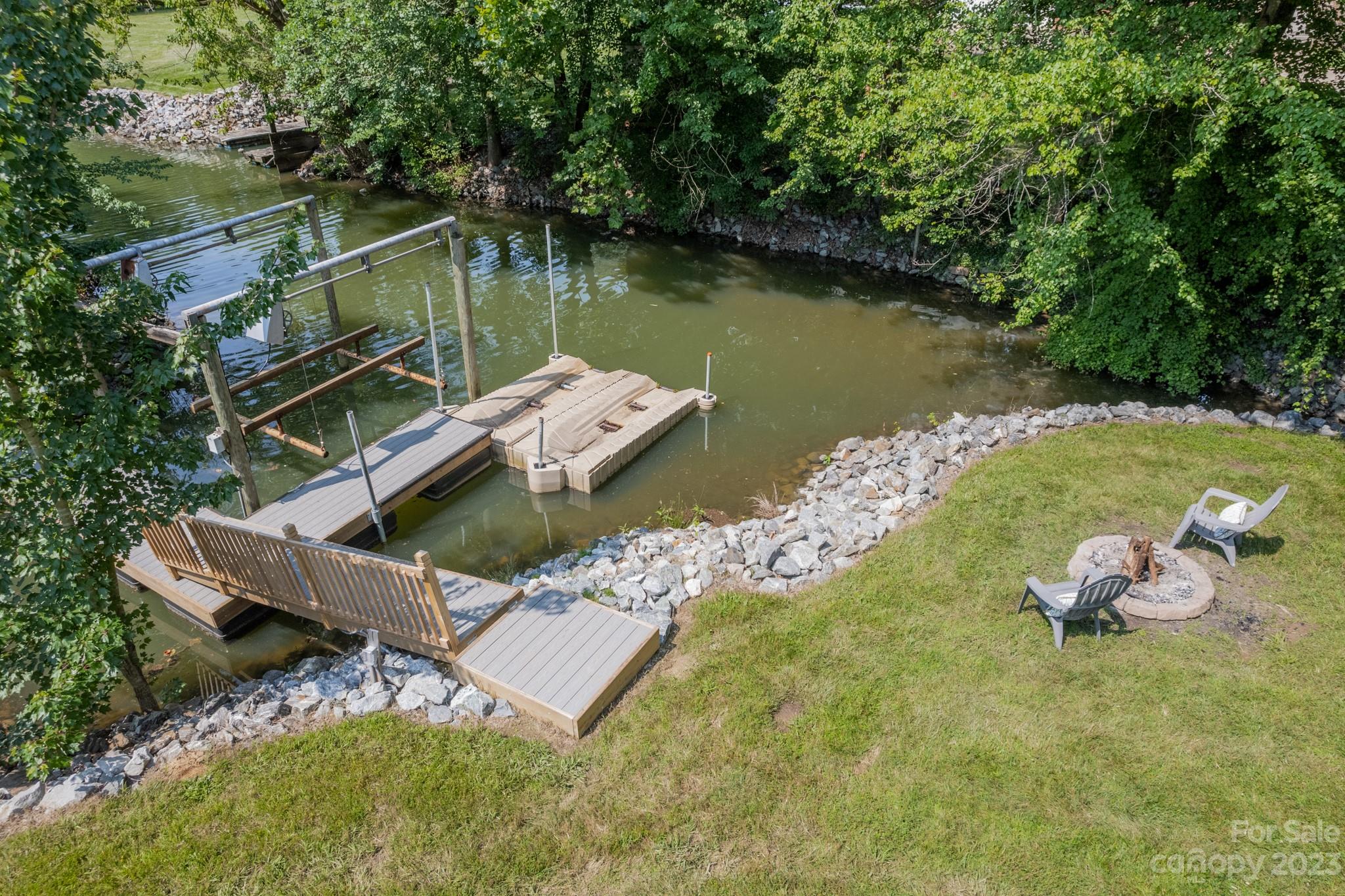175 Perrin Road Mooresville, NC 28117 - Photo 41 of 45 a view of a lake with a yard