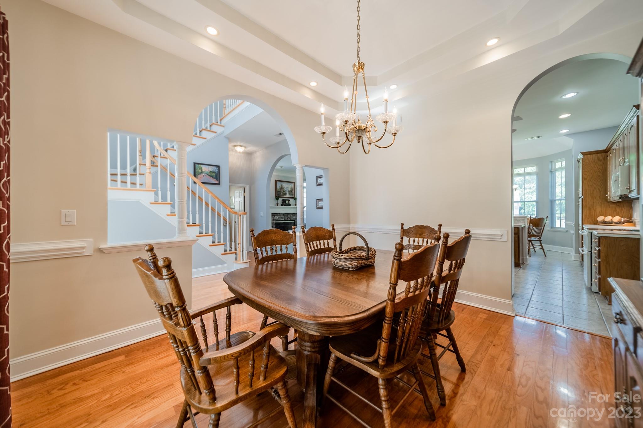 175 Perrin Road Mooresville, NC 28117 - Photo 7 of 45 a view of a dining room with furniture and wooden floor