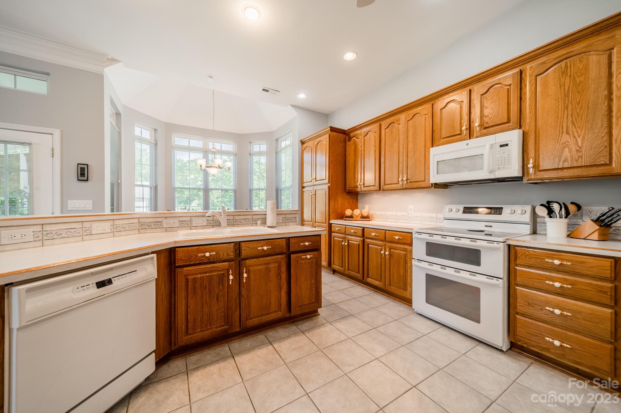 175 Perrin Road Mooresville, NC 28117 - Photo 8 of 45 a kitchen with stainless steel appliances granite countertop a stove sink and cabinets