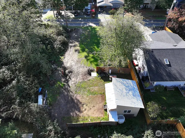 an aerial view of a house with outdoor space