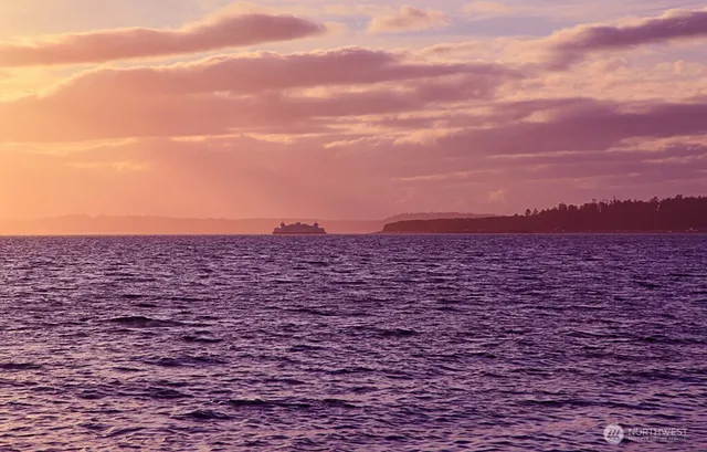 a view of a balcony with trees