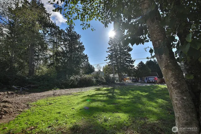 a view of outdoor space with deck and yard