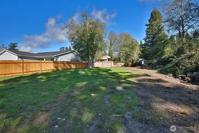 a view of a big yard with a fountain