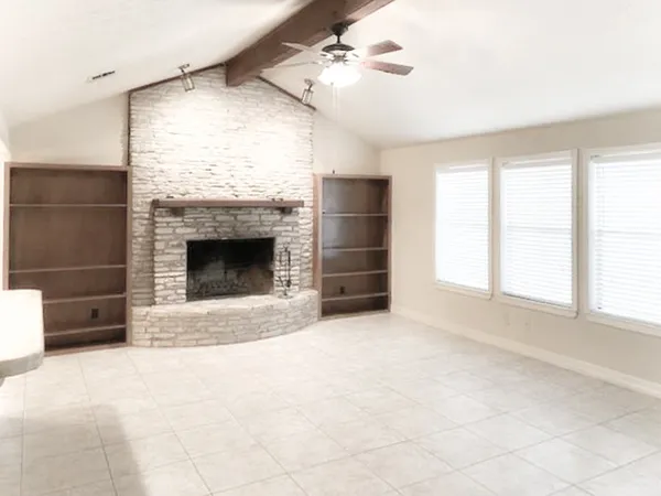 an aerial view of residential building and lake