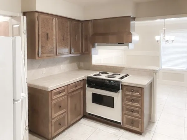 a kitchen with sink cabinets and window