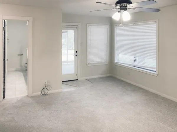 a bathroom with a granite countertop sink and a bathtub