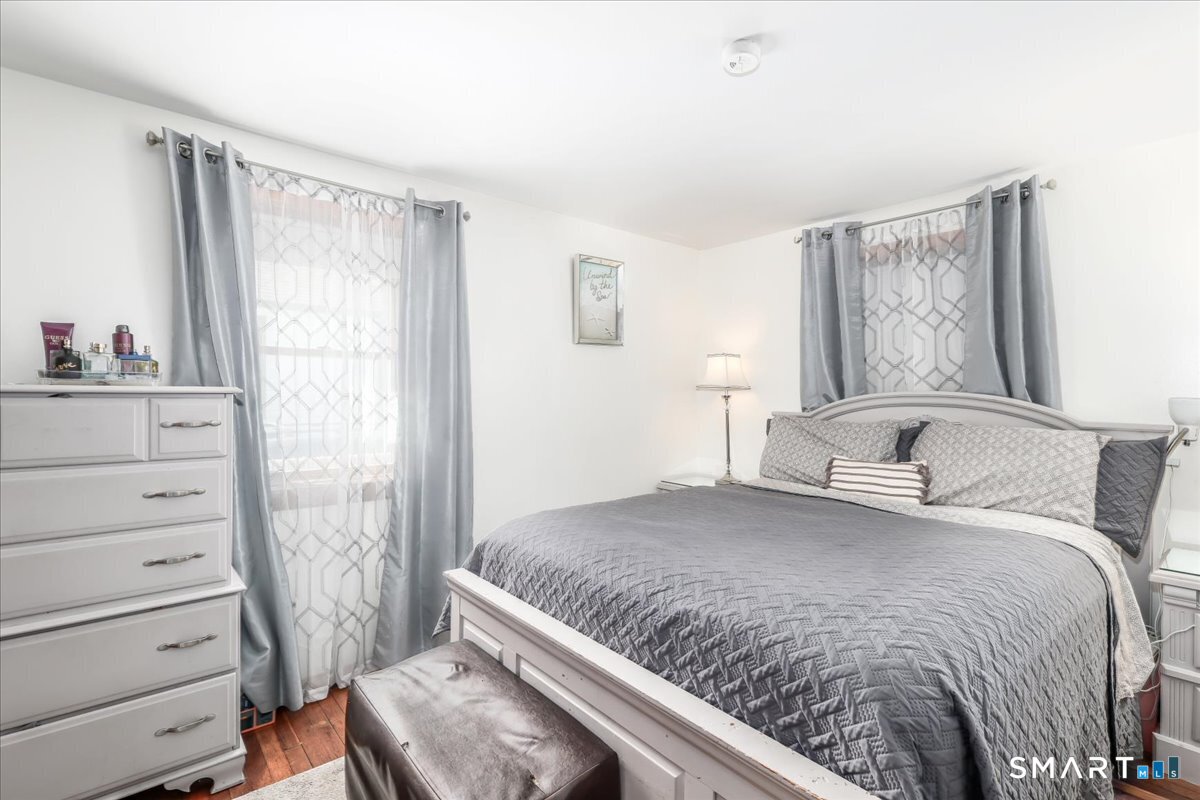 306 Welton Street Hamden, CT 06517 - Photo 13 of 38 a bedroom with a bed and a window