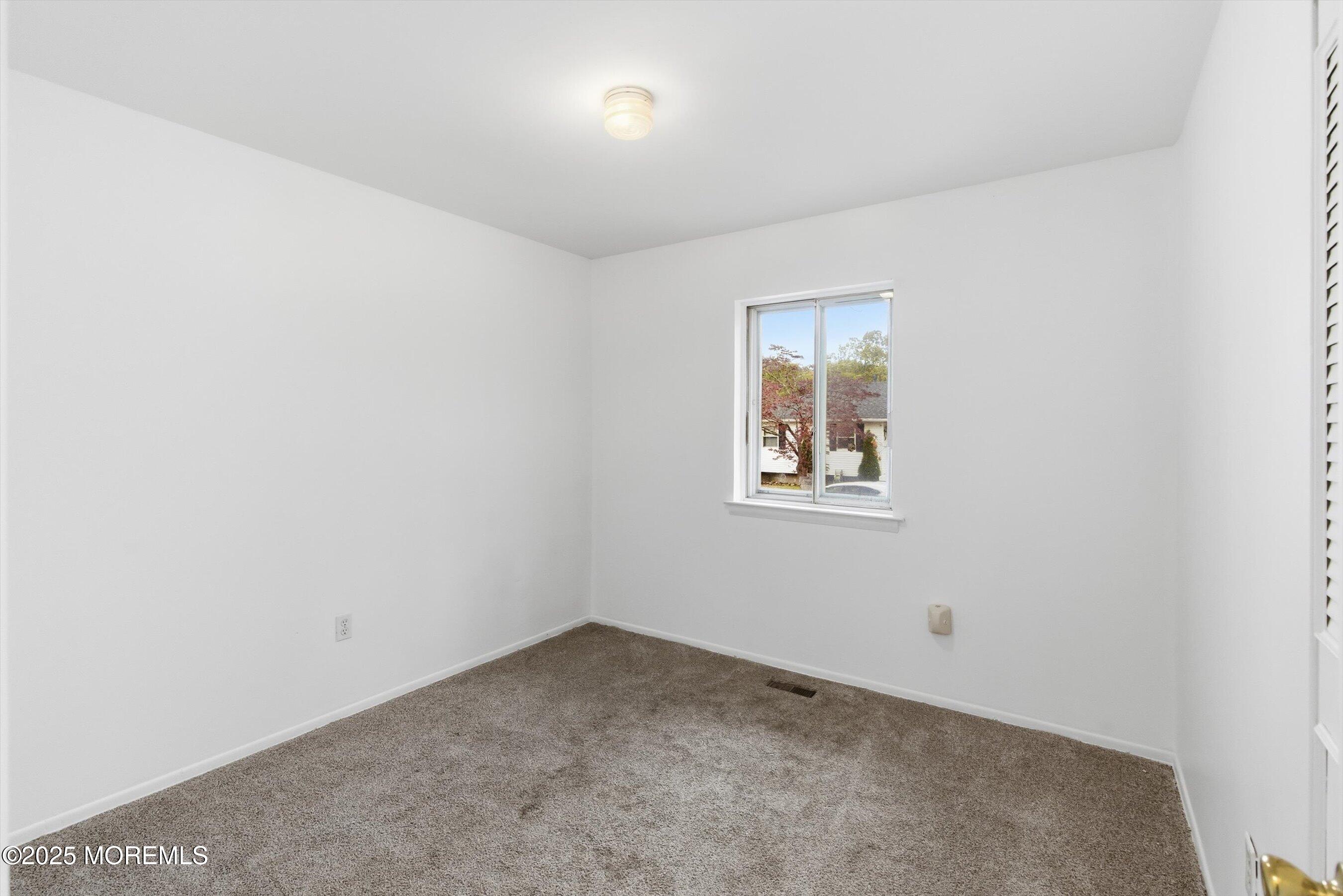 42 Monroe Avenue Browns Mills, NJ 08015 - Photo 13 of 29 an empty room with a window