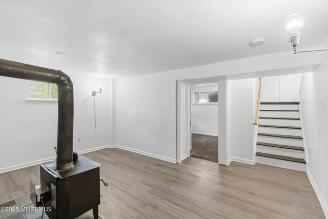 a view of a room with wooden floor