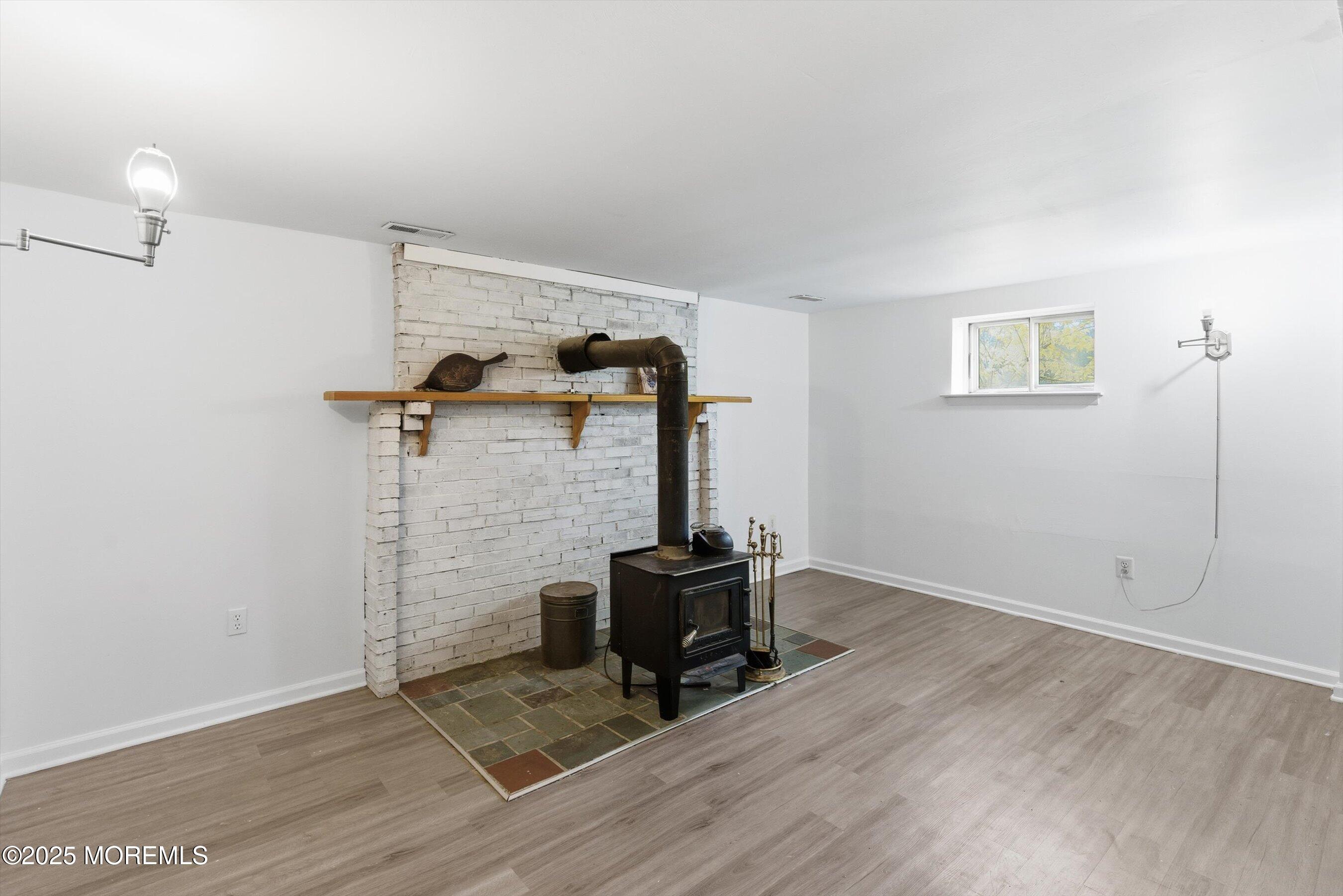42 Monroe Avenue Browns Mills, NJ 08015 - Photo 15 of 29 a room with a chair and wooden floor