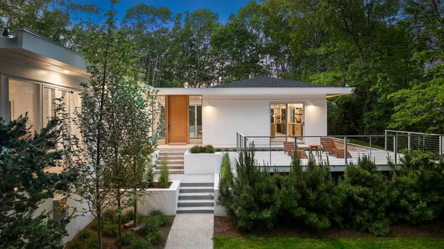 a view of house with backyard and garden