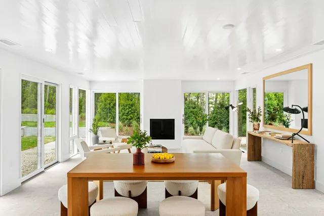 a view of a dining room with furniture window and outside view