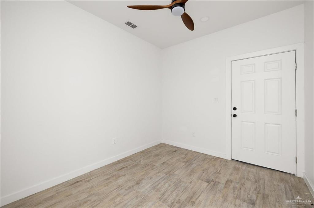 1429 West Harrison Avenue, Unit 3 Alton, TX 78573 - Photo 6 of 9 a view of a room with wooden floor