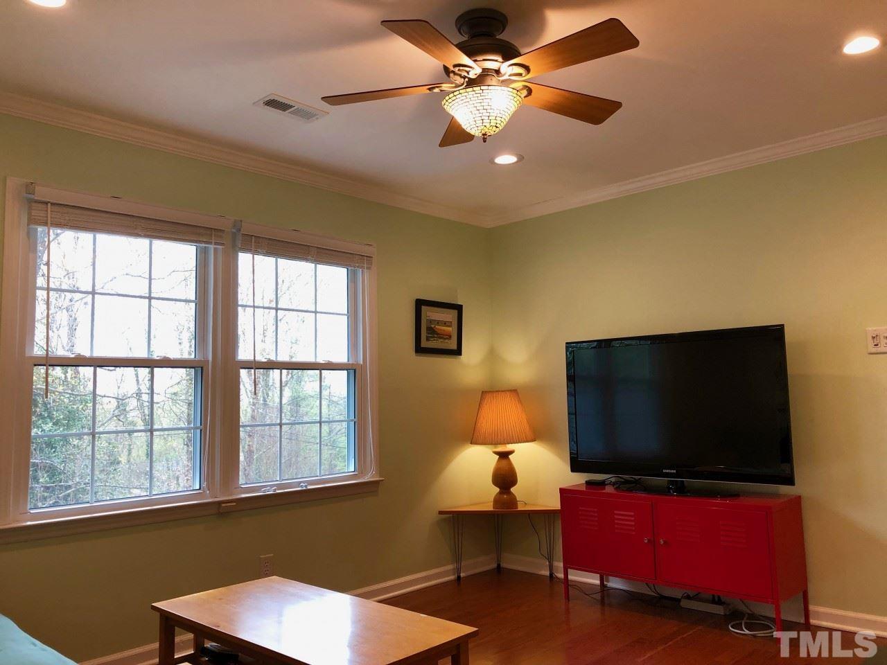5412 Fairoaks Road Durham, NC 27712 - Photo 14 of 25 a living room with furniture and a flat screen tv