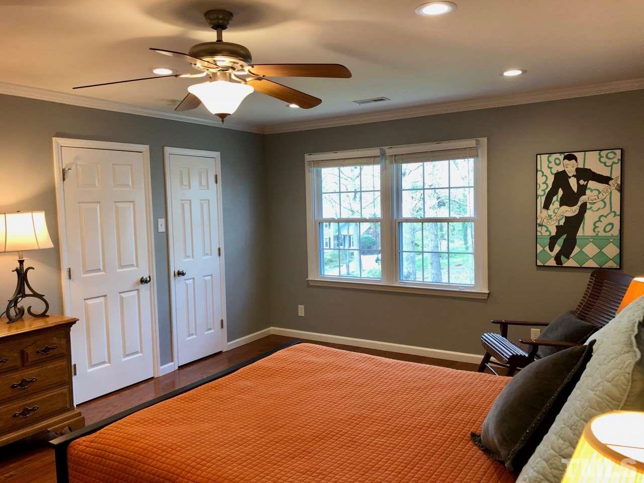 5412 Fairoaks Road Durham, NC 27712 - Photo 16 of 25 a bedroom with a bed dresser and a window