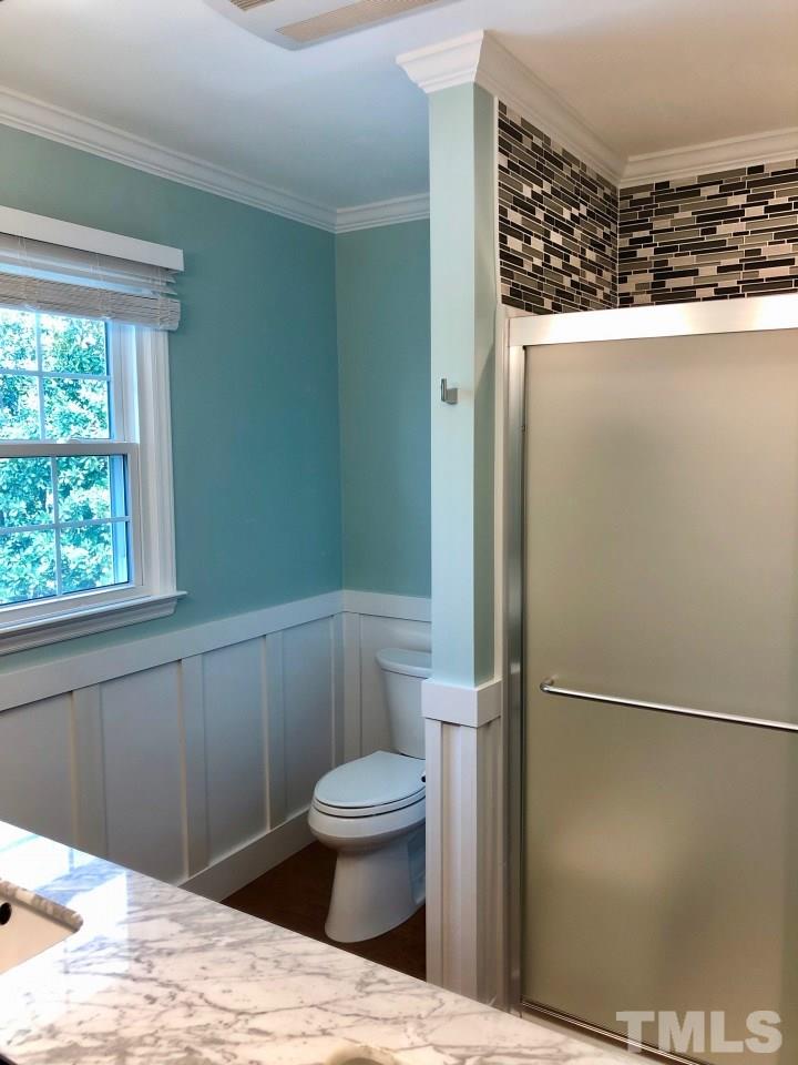 5412 Fairoaks Road Durham, NC 27712 - Photo 21 of 25 a bathroom with a toilet and a shower
