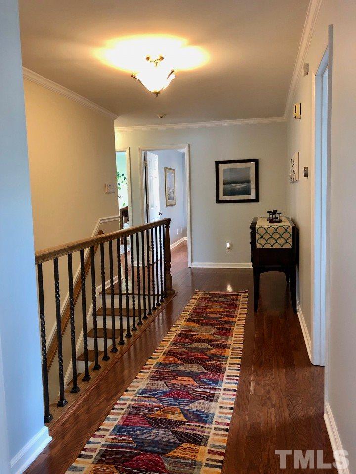 5412 Fairoaks Road Durham, NC 27712 - Photo 22 of 25 a bedroom with bed and wooden floor