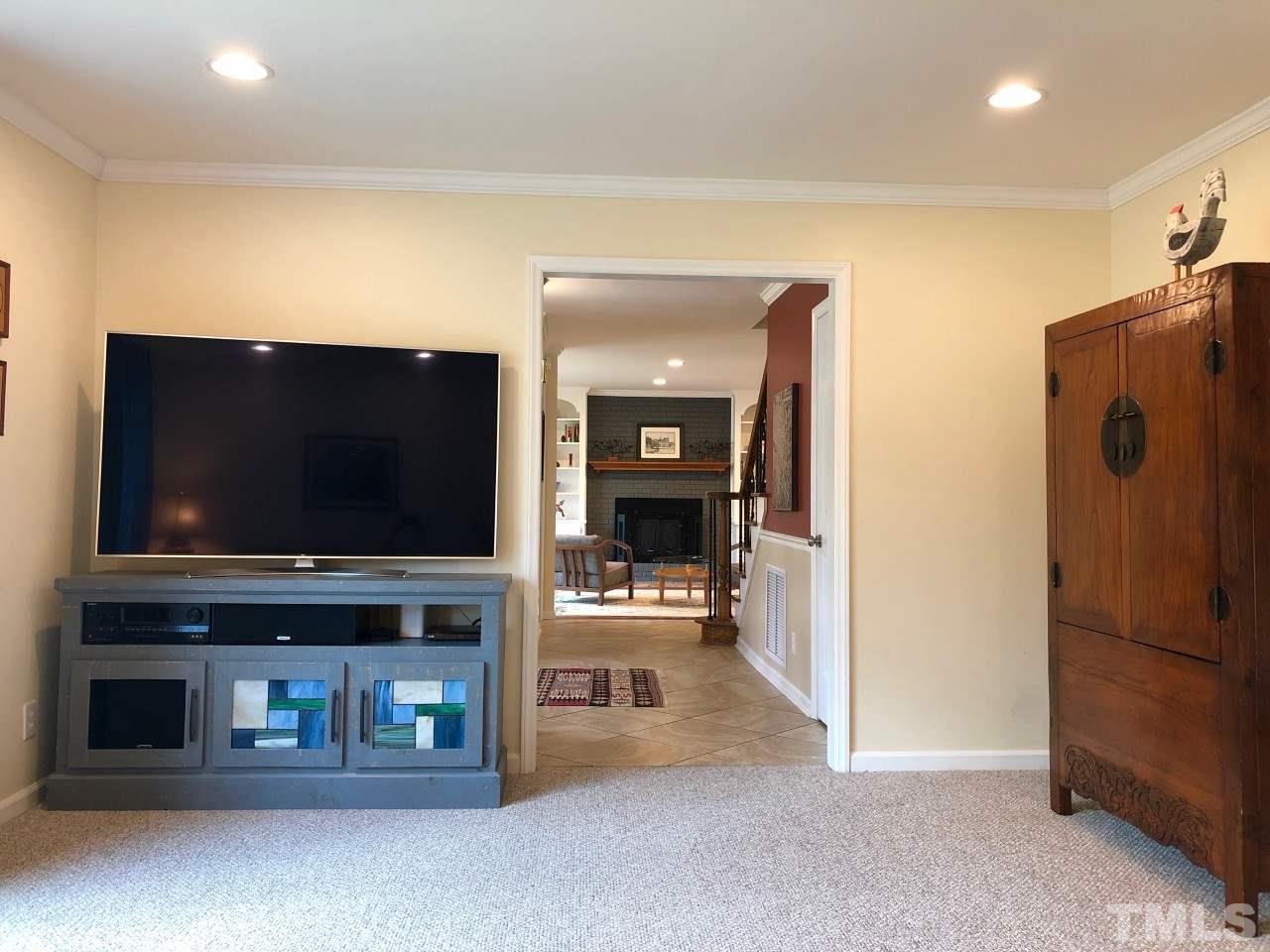5412 Fairoaks Road Durham, NC 27712 - Photo 7 of 25 a living room with furniture and a flat screen tv