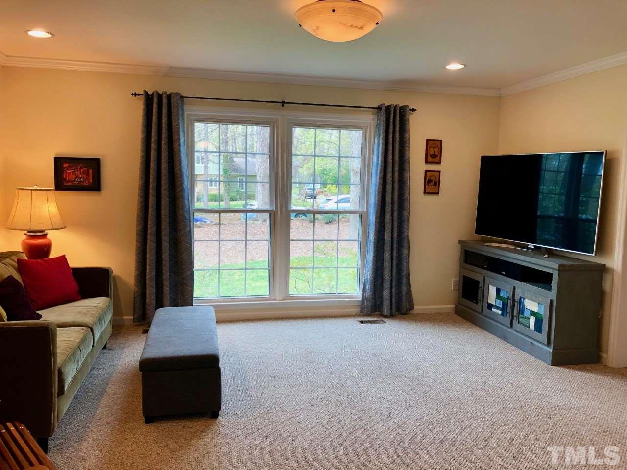 5412 Fairoaks Road Durham, NC 27712 - Photo 8 of 25 a living room with furniture and a flat screen tv